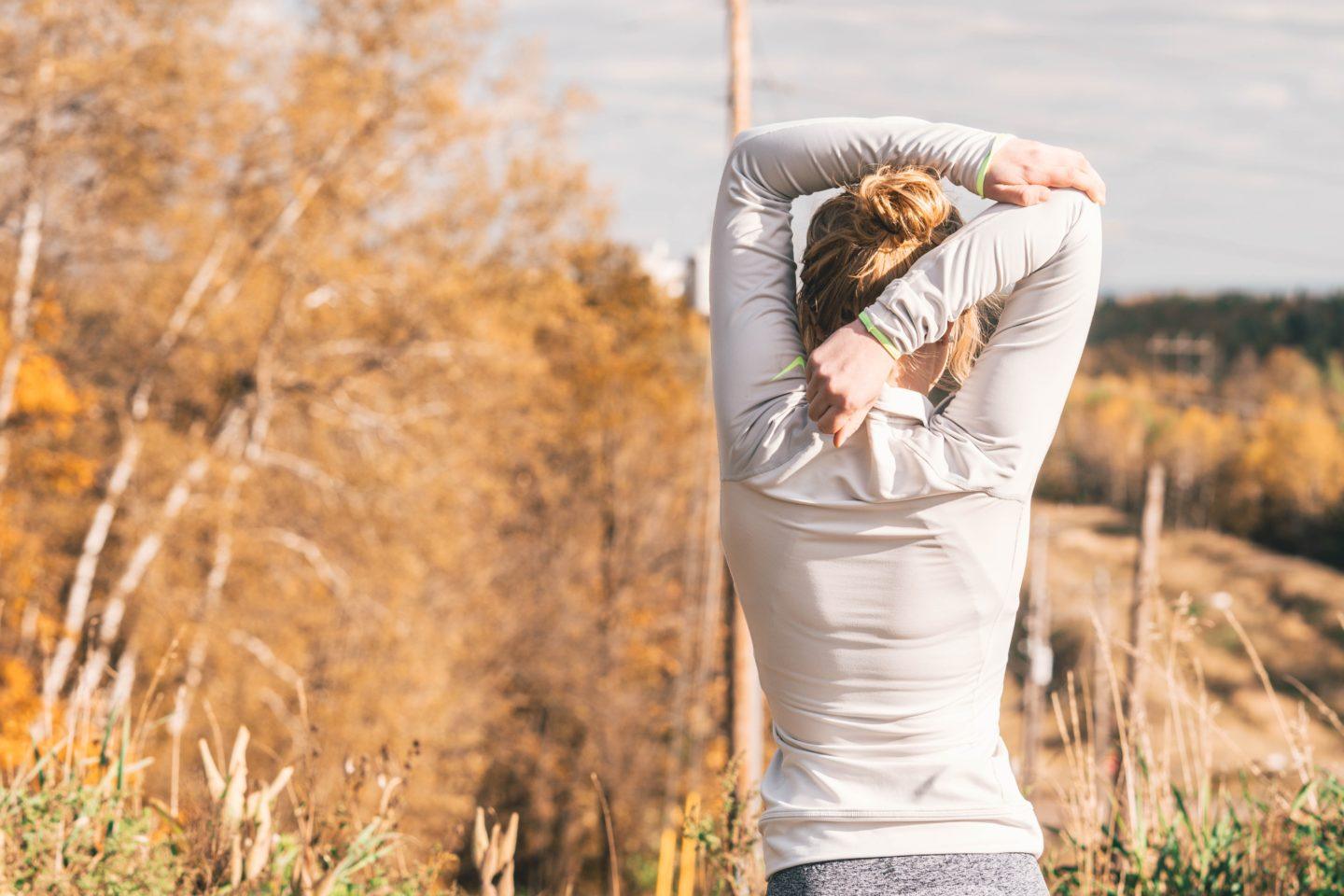 Woman stretching her arms post workout