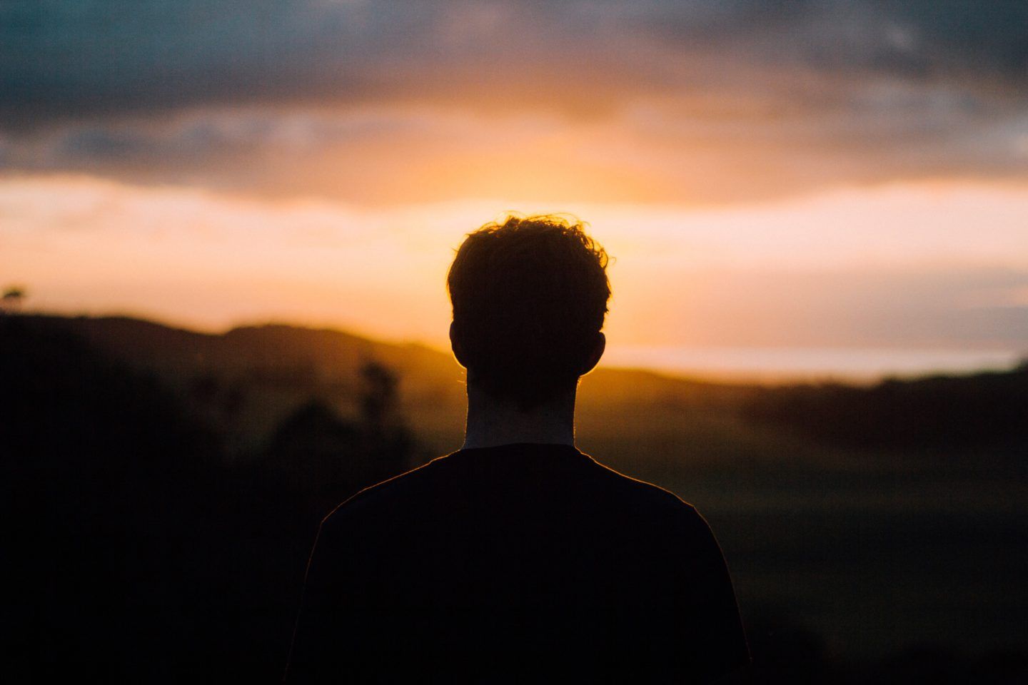 Man looking at sunset