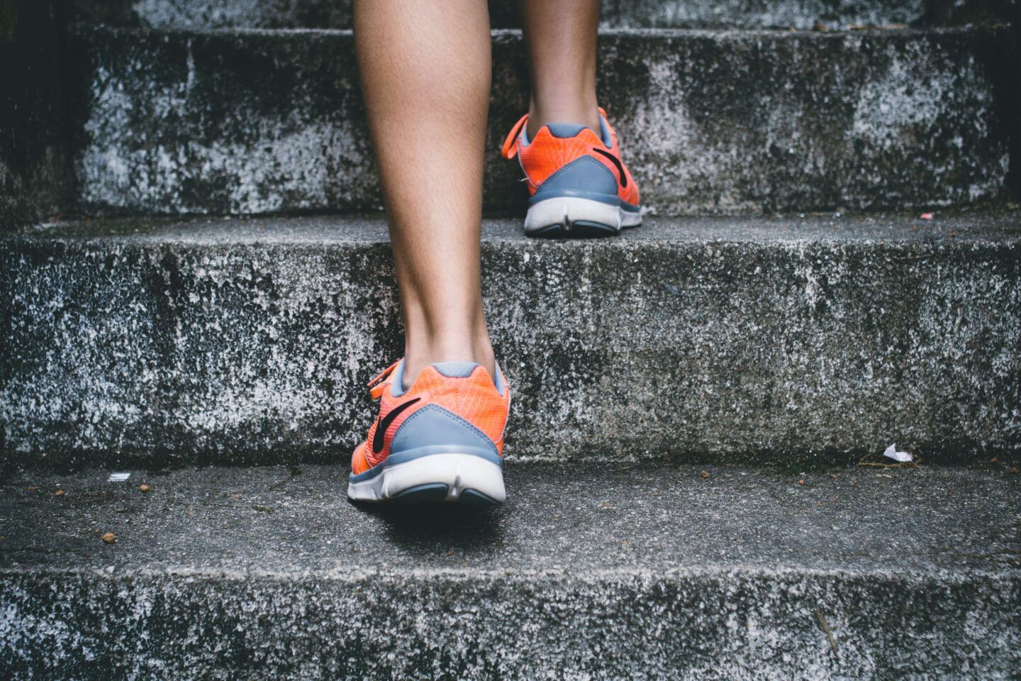 runner's shoes, racing up some stairs in the rain