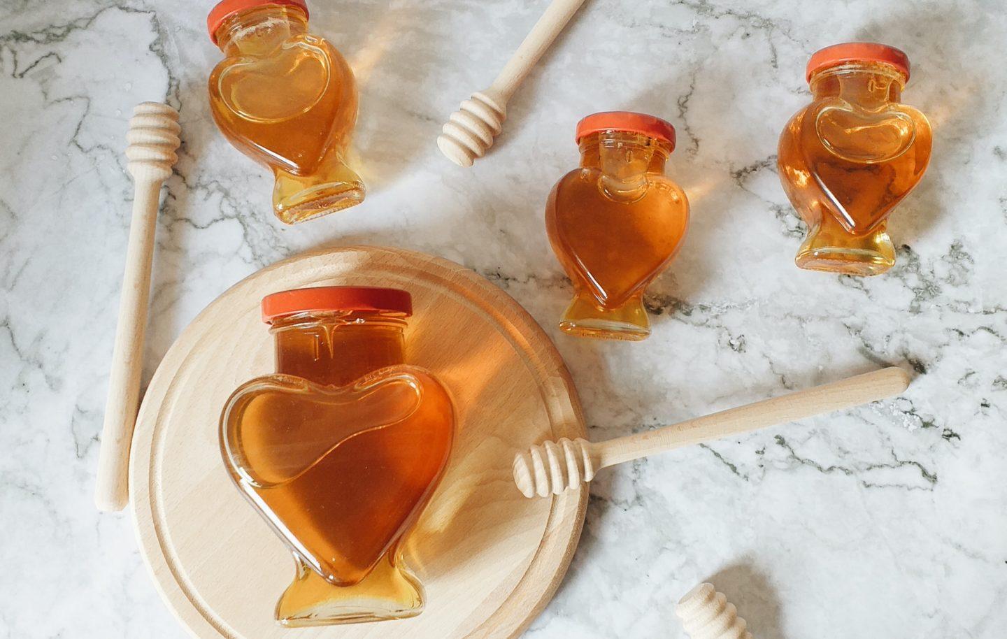 heart shaped honey jars on table