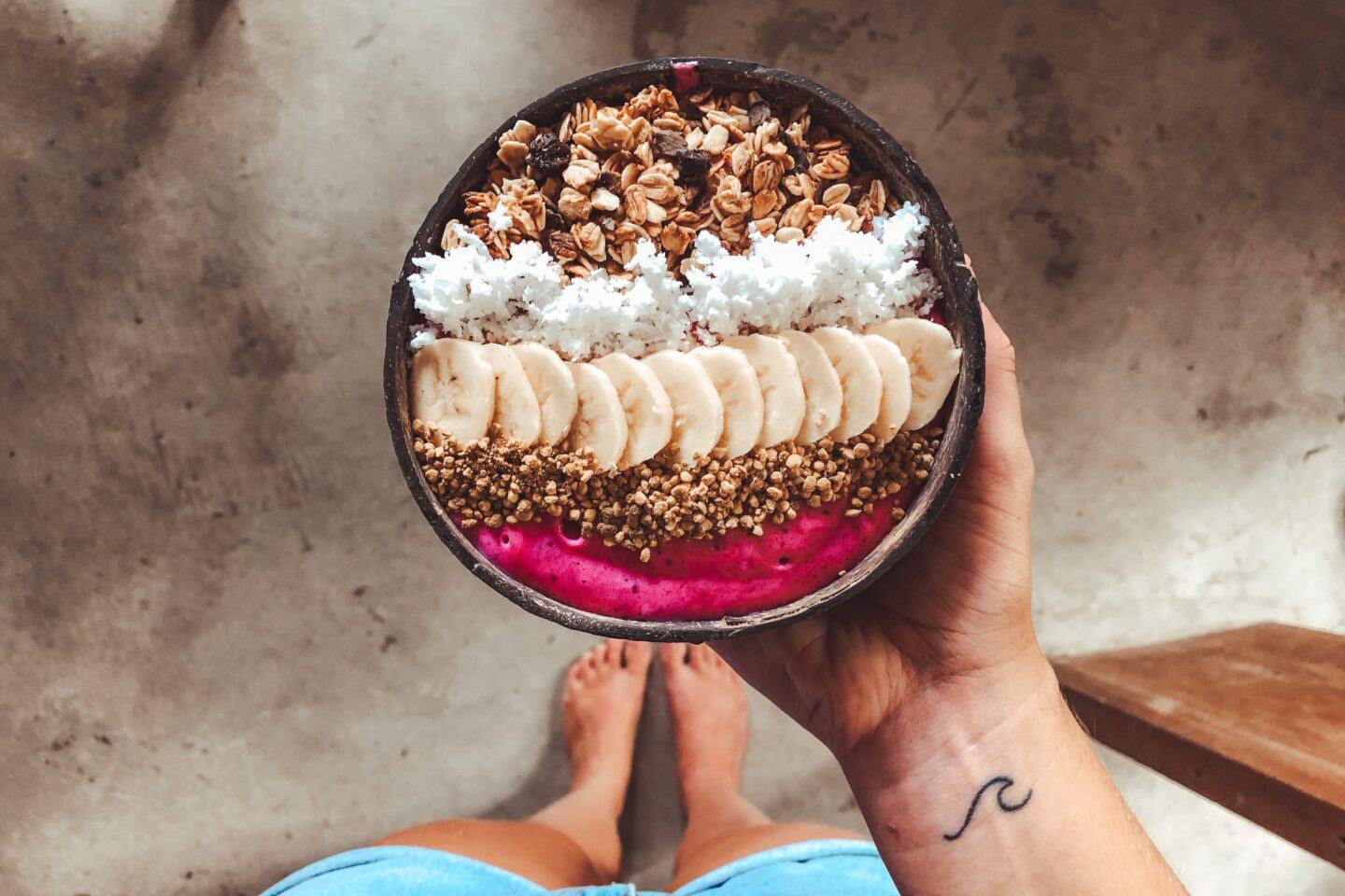 A nutrient packed smoothie bowl, filled with fresh fruits and seeds