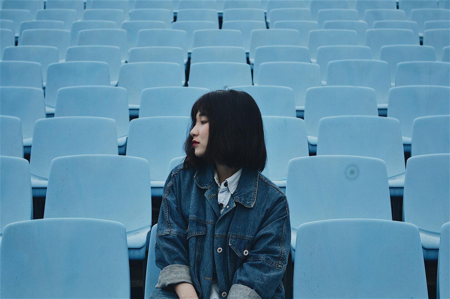 Someone sitting quietly in a blue chair