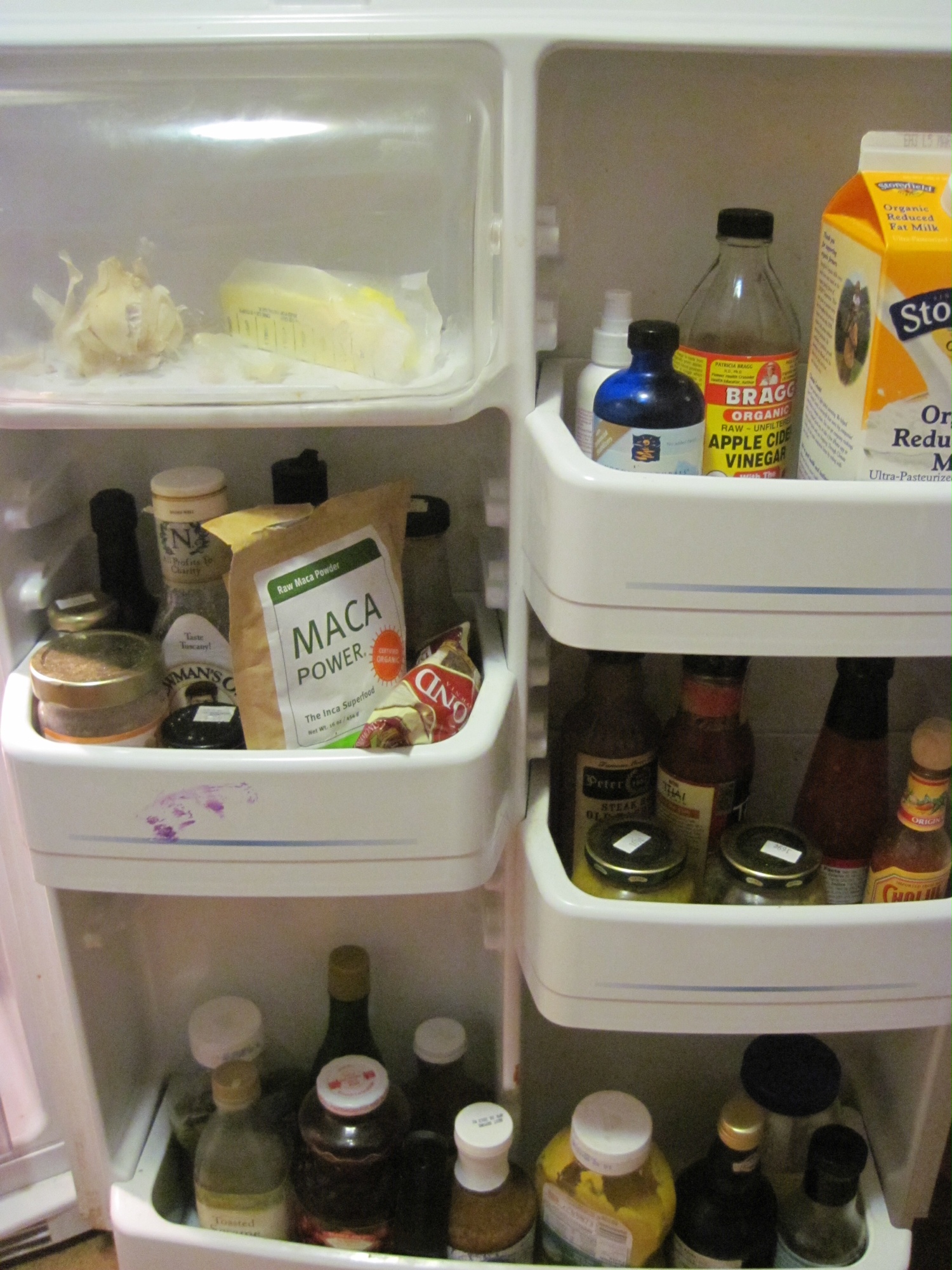 A close up of full fridge shelves