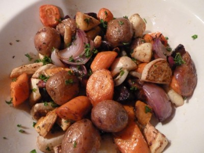cooked carrots, onions, and parsnips in a white bowl