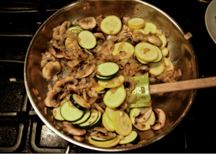 mushrooms, squash, zucchini cooking in a pan
