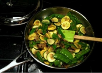 mushrooms, zucchini, and green snap peas in a pan