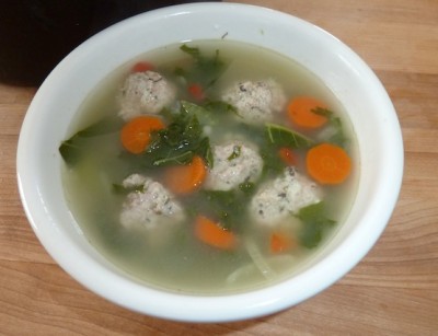 italian wedding soup in a white bowl
