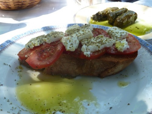 A lovely meal from my own trip to Greece, consisting of fresh bread, tomatoes, olive oil, and fresh cheese