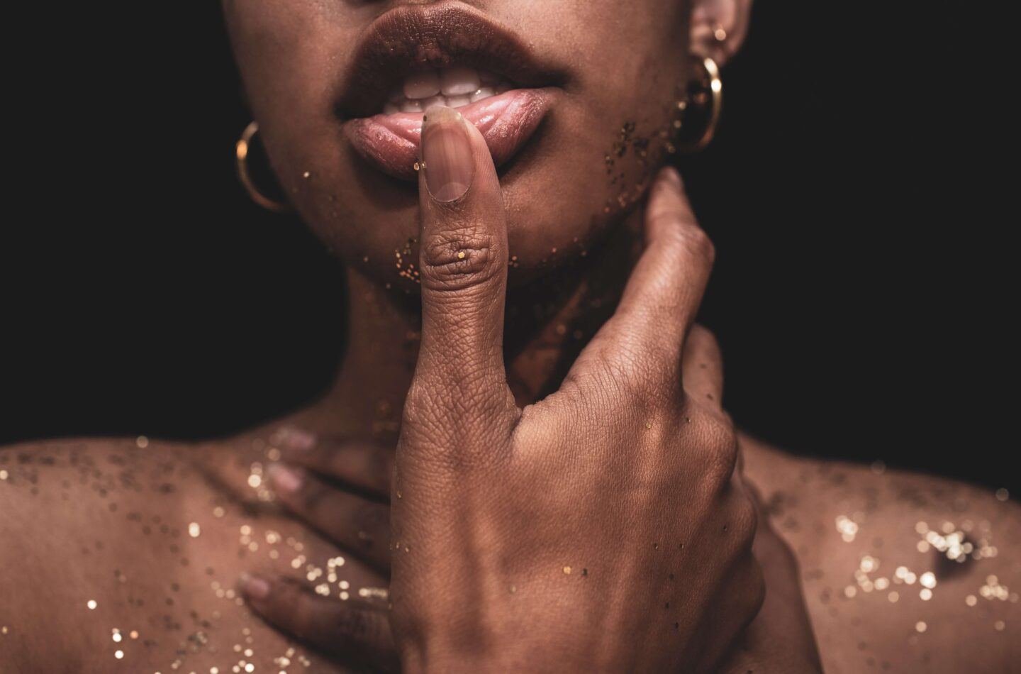 Someone seductively touching their lips