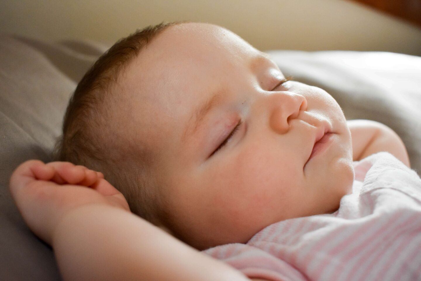 A close up of a baby sleeping peacefully