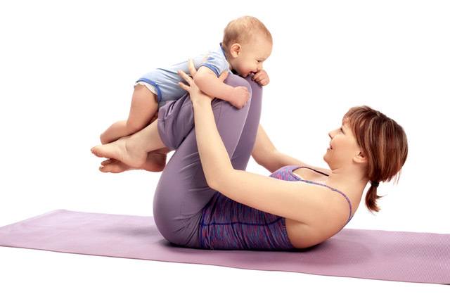 Mom and her baby doing yoga