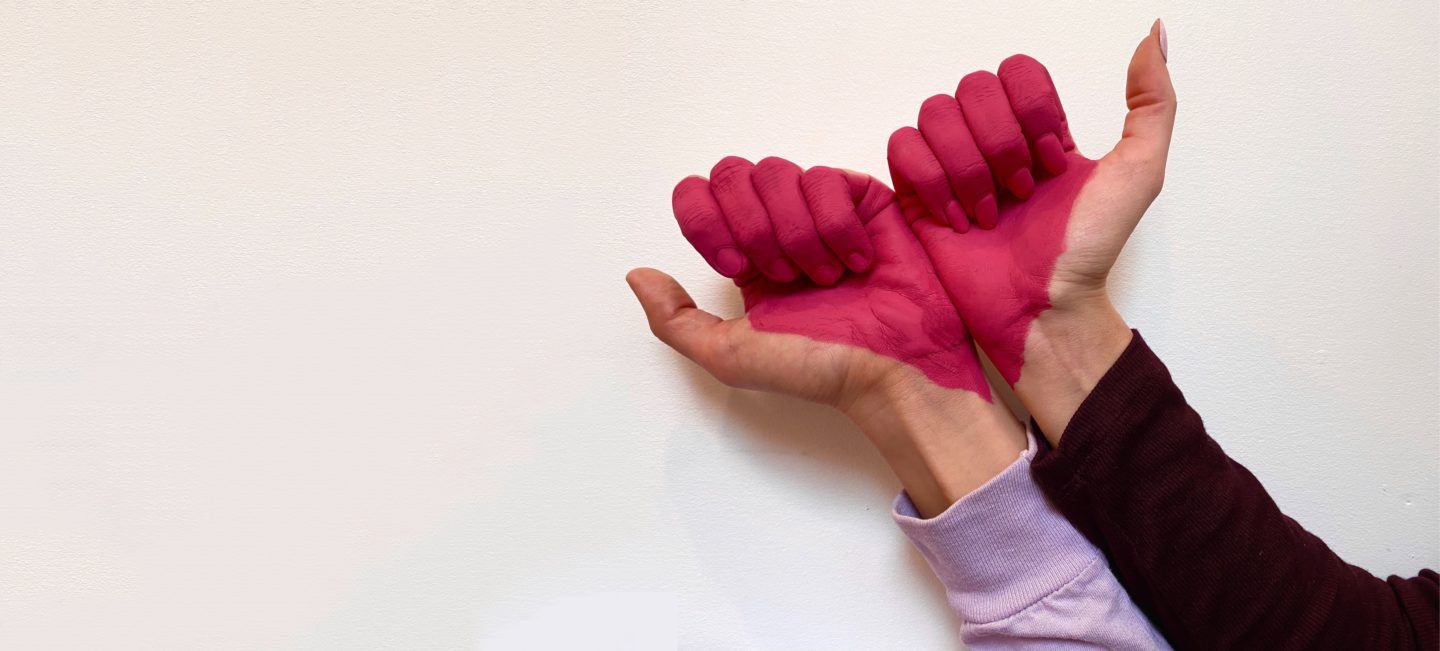 Two friends join together to make a heart