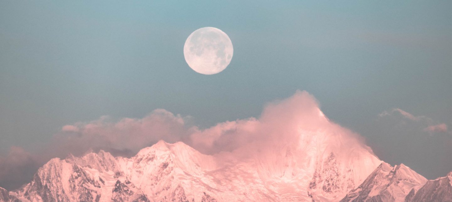 Full moon over pink mountains