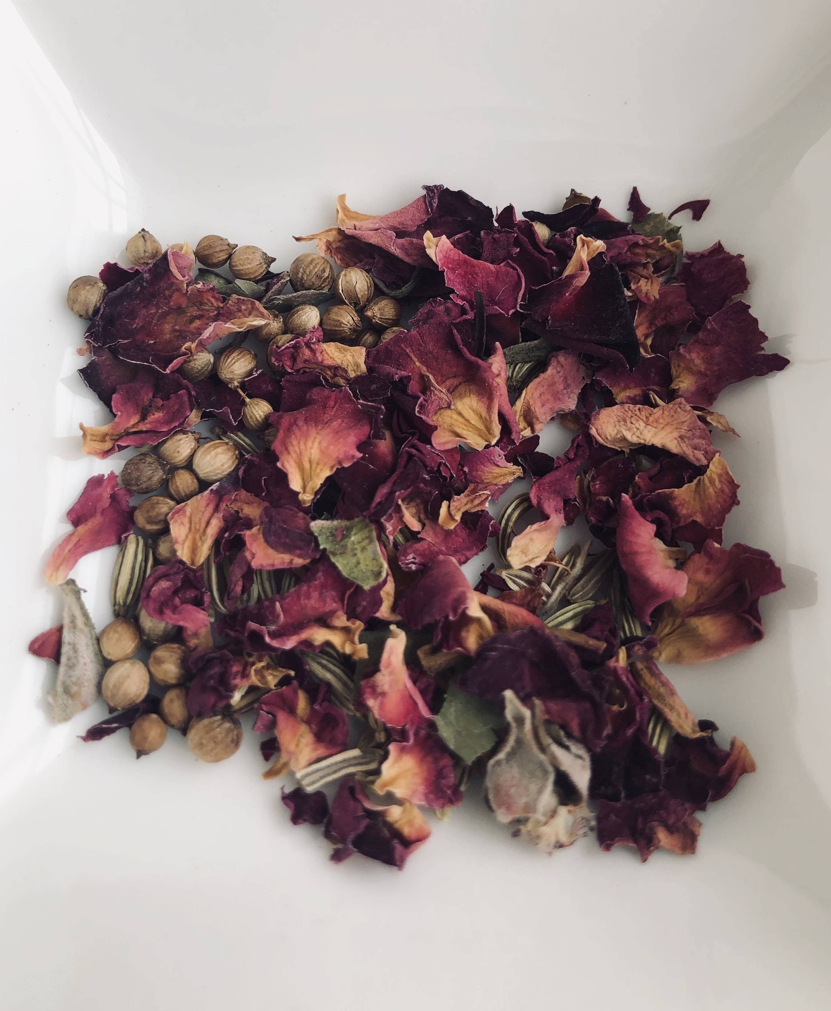 Dried rose petals in a bowl
