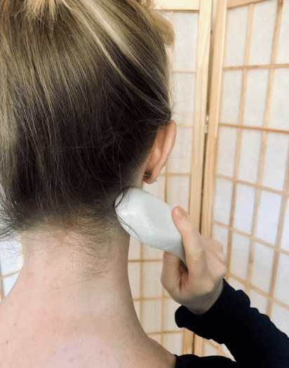 Back neck being gua sha'd