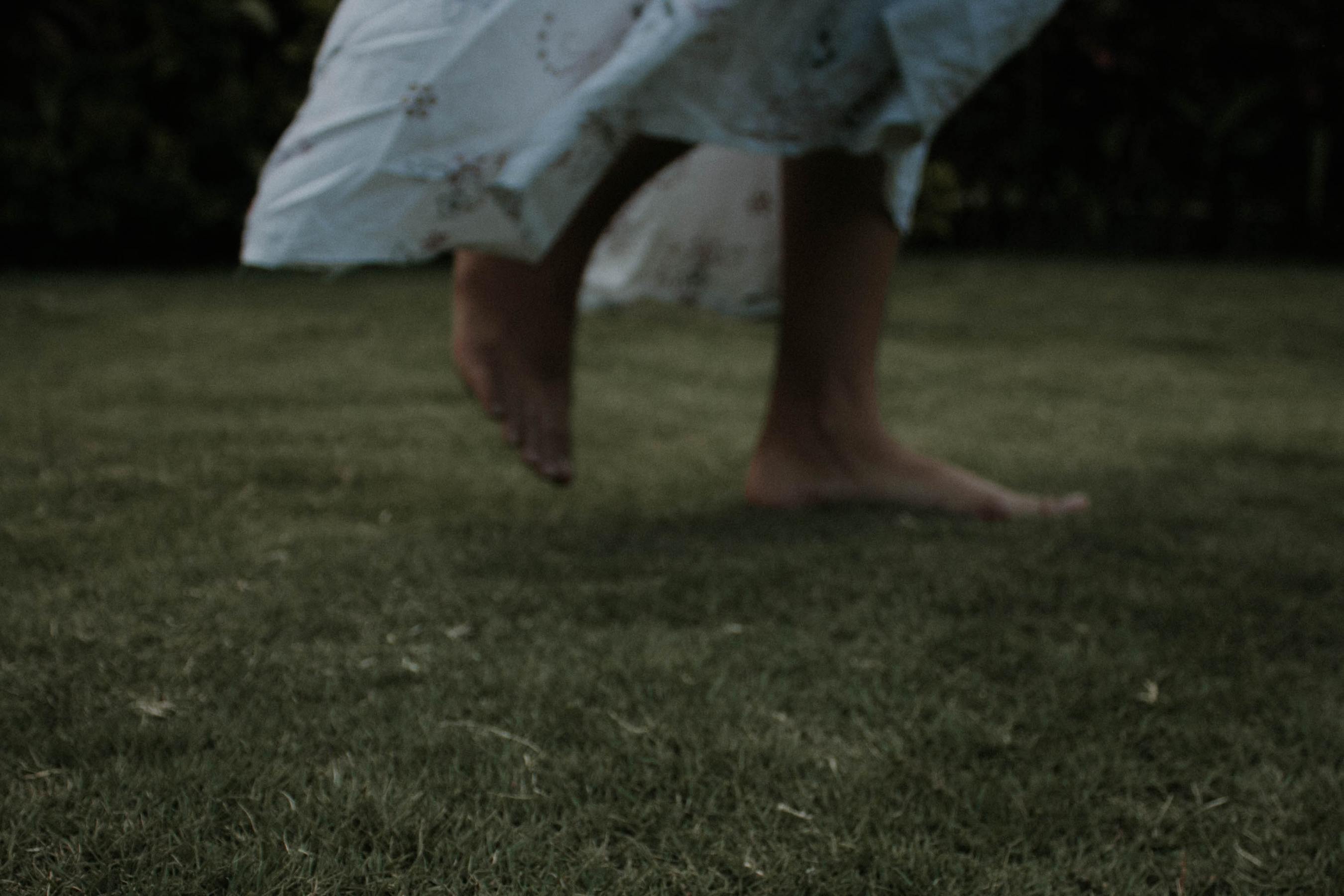 barefoot woman in white dress