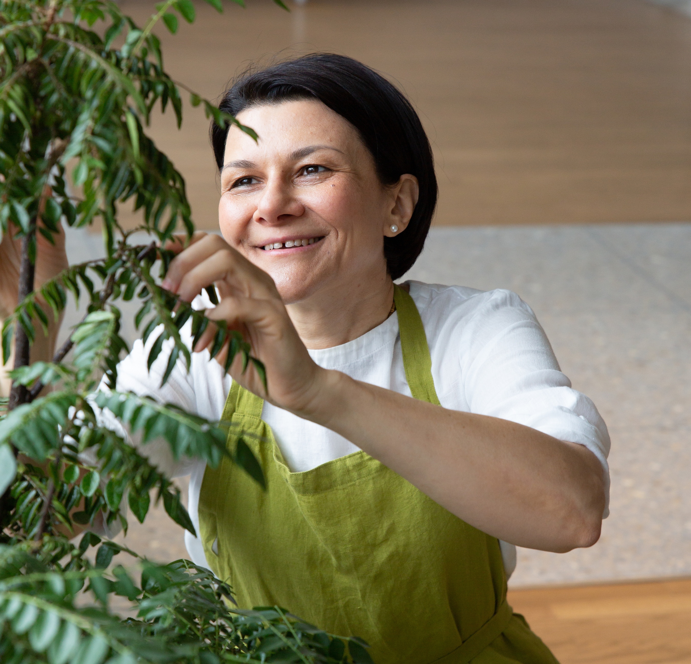 Divya Alter with a plant