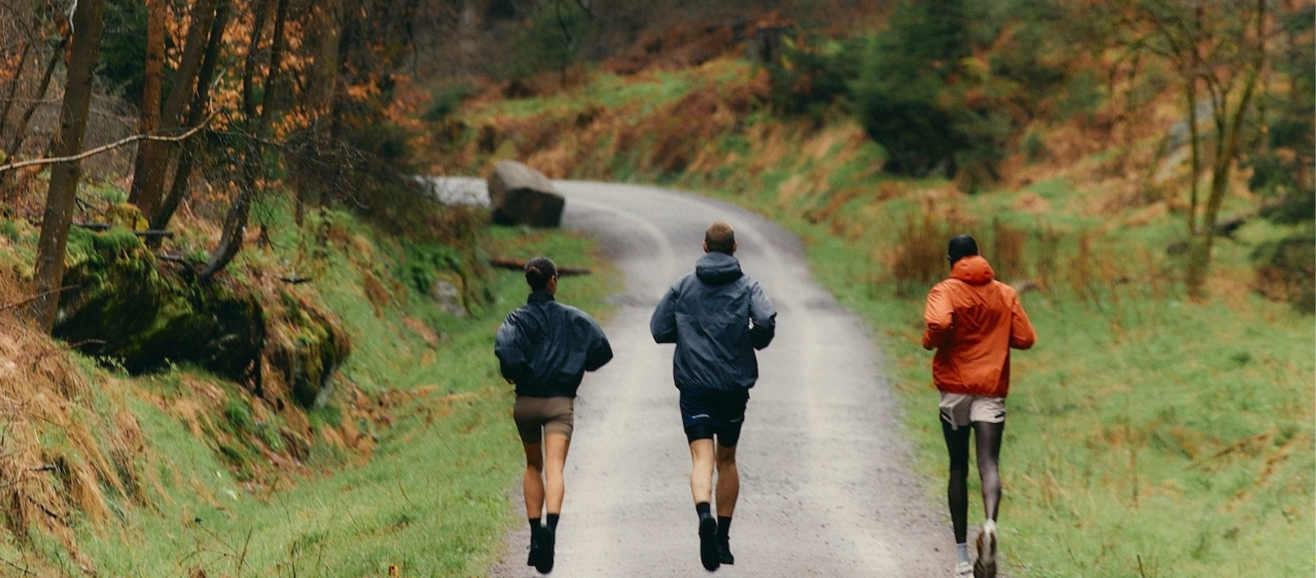 Friends embracing the autumn nodes while running 